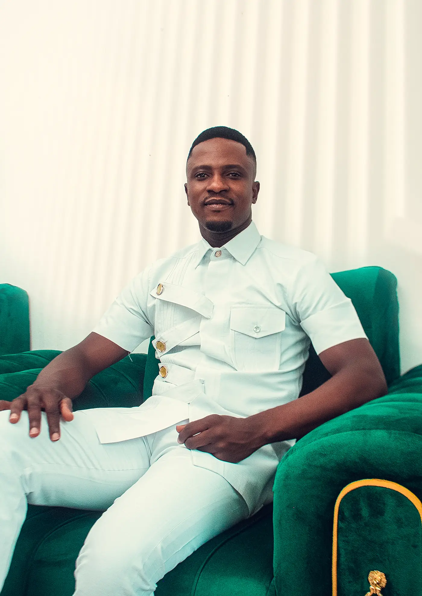 Revivalist Jude Osei Ababio seated, smiling